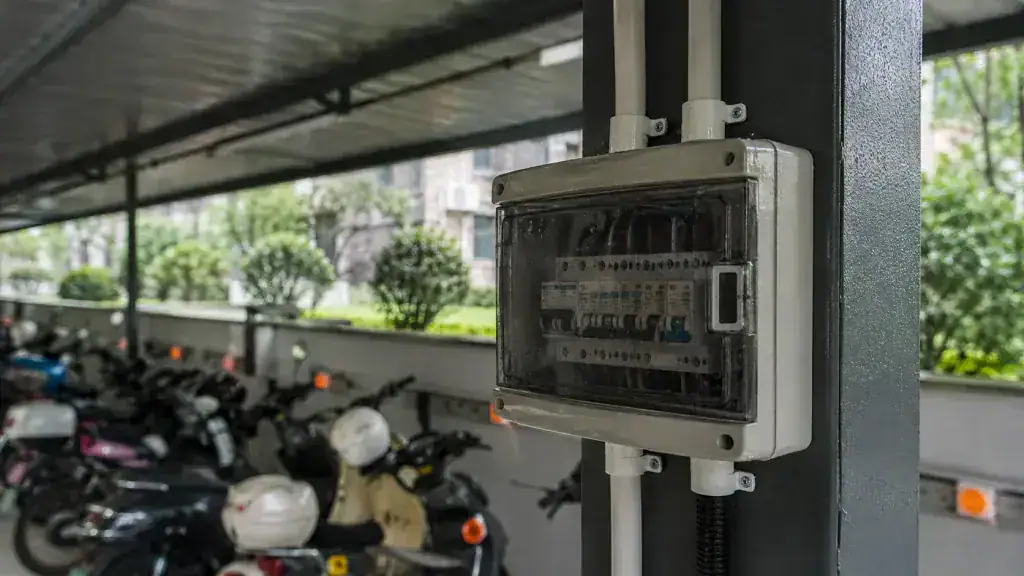 Residential e-bike charging area under a steel canopy