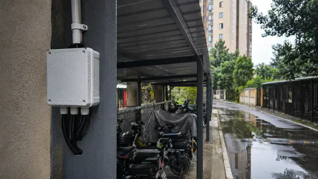 Residential e-bike charging area under a steel canopy